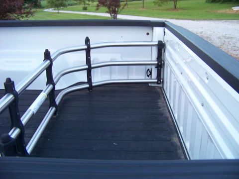 2011 Ford F-250 - View of a truck bed interior, showing a cargo divider mounted near the cab.