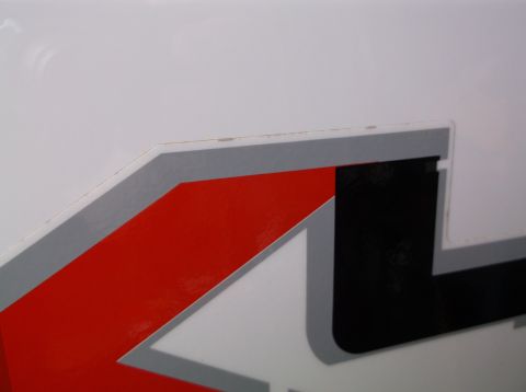 2011 Ford F-250 - Close-up of a graphic decal on the side of a white truck.