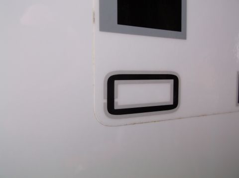 2011 Ford F-250 - A close-up shot of a vehicle's exterior trim piece, with a Supermotors.net watermark at the bottom.