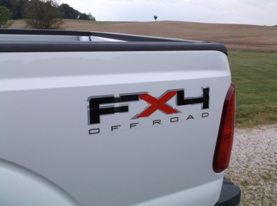 White pickup truck rear quarter panel with FX4 OFF ROAD decal