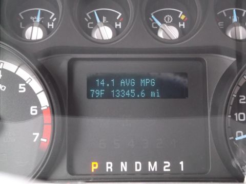 2011 Ford F-250 - The digital display on the dashboard shows average MPG, temperature, and mileage.