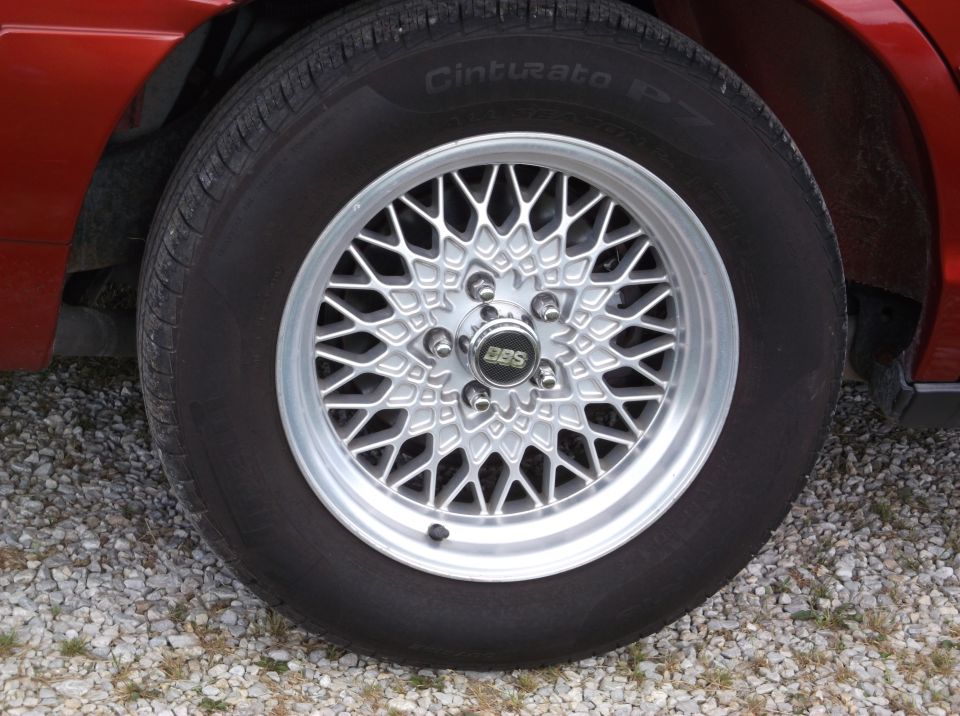 Red car with BBS rims and Pirelli Cinturato tires
