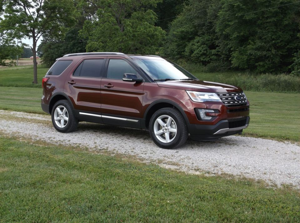 Brown 2016 Ford Explorer 3q-front view on gravel driveway