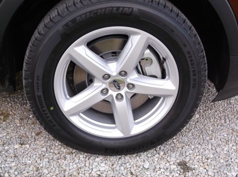 2016 Ford Explorer - Wheel and tire detail from a 2016 Ford Explorer, showing the Michelin Latitude Tour HP tire.