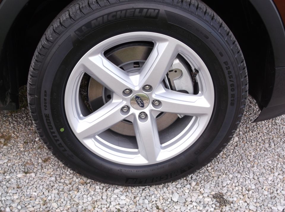 Close-up of a 2016 Ford Explorer wheel with a Michelin tire. The Ford logo is visible on the center cap