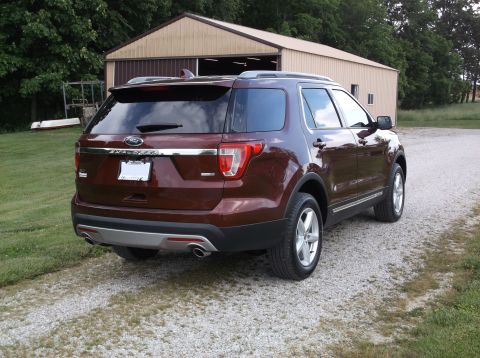 2016 Ford Explorer - Maroon 2016 Ford Explorer parked in front of a barn.