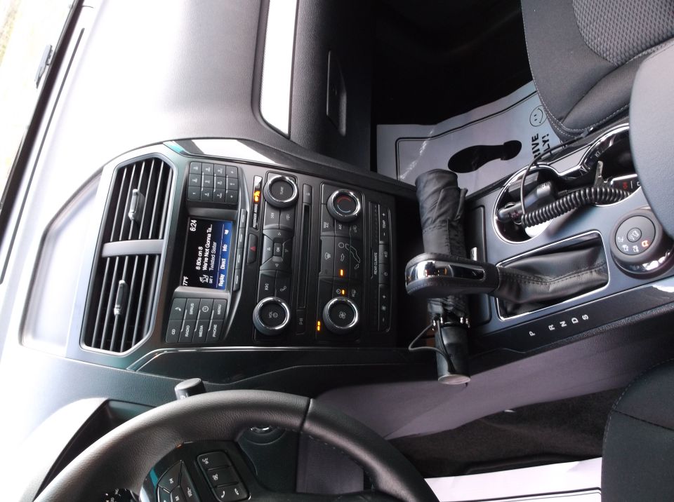 2016 Ford Explorer interior showing dashboard, center console, gear shifter, and part of steering wheel