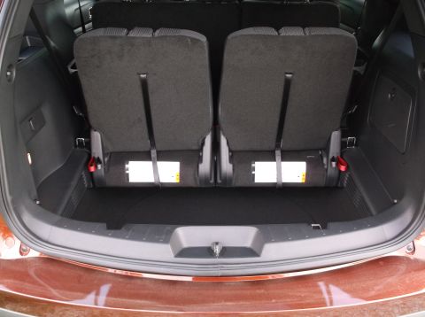 2016 Ford Explorer - Rear cargo area with folded third-row seats in a 2016 Ford Explorer.