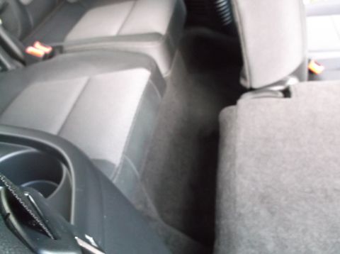 2016 Ford Explorer - Interior view of rear seats and floor. No year or make is discernible from the image.