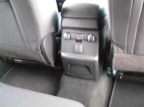 2016 Ford Explorer - Interior view of a vehicle's rear seating area, focusing on the center console and adjacent seats.