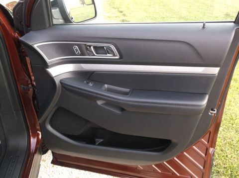 2016 Ford Explorer - Driver's side door interior of a 2016 Ford Explorer, black leather and silver accents.