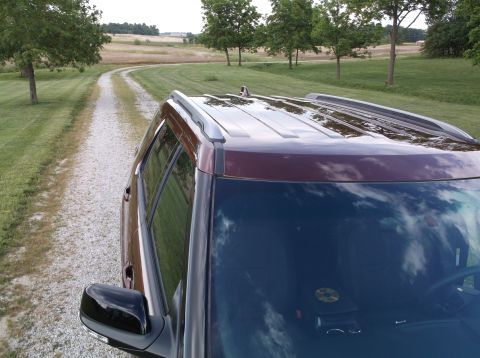2016 Ford Explorer - The vehicle is parked on a gravel road leading through a rural landscape.