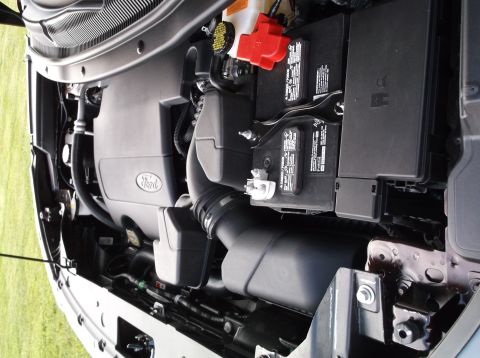 2016 Ford Explorer - The engine bay of a 2016 Ford Explorer is shown from a top-down perspective.