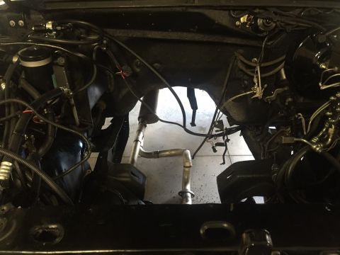 1982 Ford Bronco - Custom exhaust pipes are visible in the engine bay, suggesting modifications or repairs.