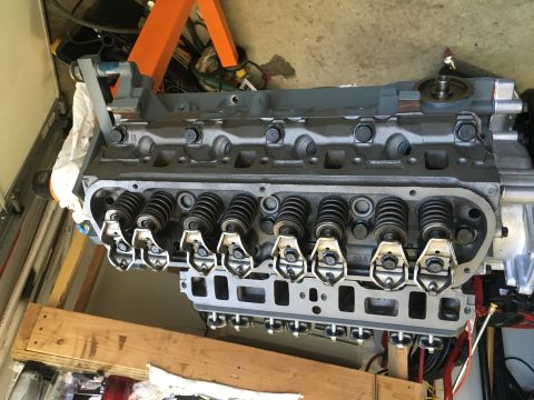 1987 Ford Bronco - Close-up view of an engine assembly, likely undergoing maintenance or rebuild.