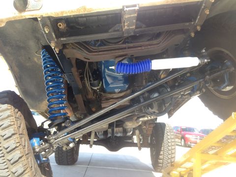 1979 Ford Bronco - Undercarriage view of a 1979 Ford Bronco, highlighting new suspension parts.