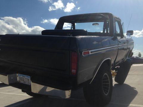 1979 Ford Bronco - Rear view of a dark blue 1979 Ford Bronco, a custom license plate that reads BK BETTY.