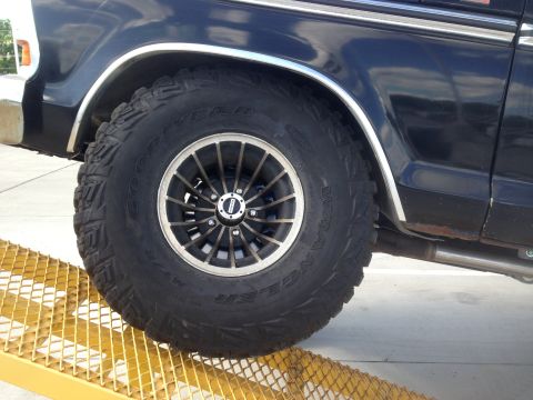 1979 Ford Bronco - Rear wheel and fender detail of a 1978 Ford Bronco with aftermarket wheels and tires.