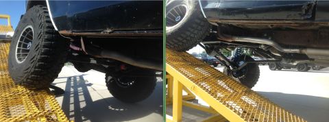 1979 Ford Bronco - Underbody of a lifted truck on ramps, showing suspension and exhaust components.