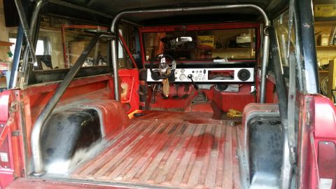 1968 Ford Bronco - Interior view of a 1968 Ford Bronco, showing the dashboard, seats, and roll cage.