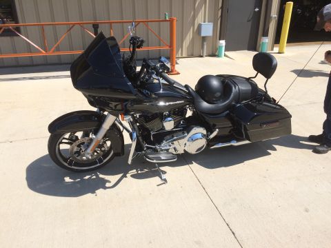 2004 Harley-Davidson Fat Boy - A black 2004 Harley-Davidson Fat Boy motorcycle is parked outside on a sunny day.