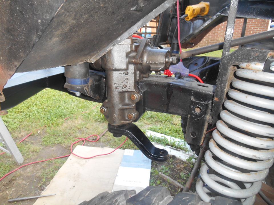 Close-up of steering box and suspension on a vehicle frame