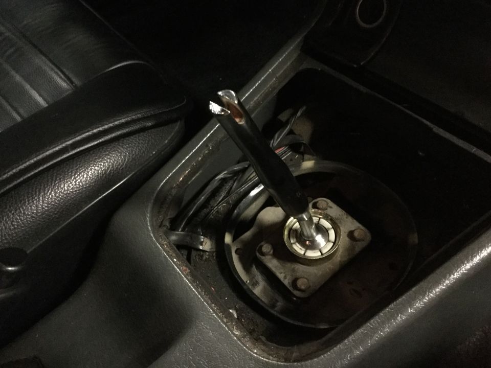 Gear shifter mechanism inside a car's center console
