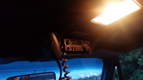 1978 Chevrolet C/K Pickup - Interior shot of a vehicle's headliner with a CB radio and microphone installed.