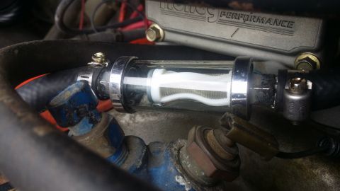 1978 Chevrolet C/K Pickup - Close-up of an engine's inline fuel filter with visible filter media.