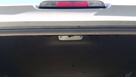 1992 Ford Bronco - Rear cargo area interior trim and third brake light visible.