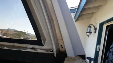 1992 Ford Bronco - The rear window trim and weatherstripping of a 1992 Ford Bronco are shown.