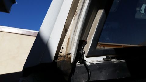 1992 Ford Bronco - Close-up view of the rear window trim and weatherstripping on a 1992 Ford Bronco.