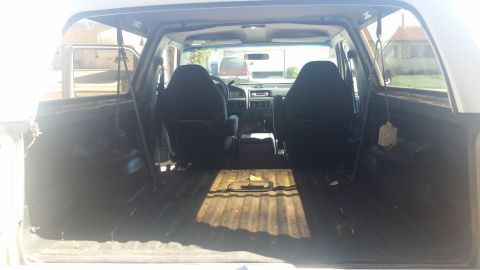 1992 Ford Bronco - The interior of this 1992 Ford Bronco features two front seats and an open cargo space.