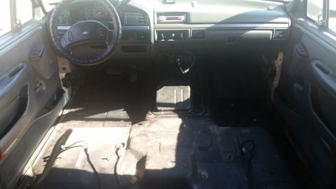 1992 Ford Bronco - Interior view of a 1992 Ford Bronco, highlighting the dashboard and floor area.