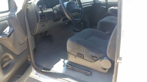 1992 Ford Bronco - Interior view of a 1992 Ford Bronco, highlighting the seats and dashboard.