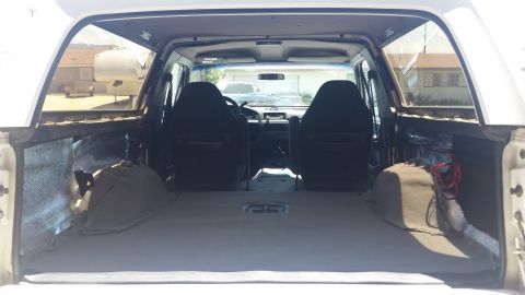1992 Ford Bronco - View of the interior cargo area and front seats of a 1992 Ford Bronco.