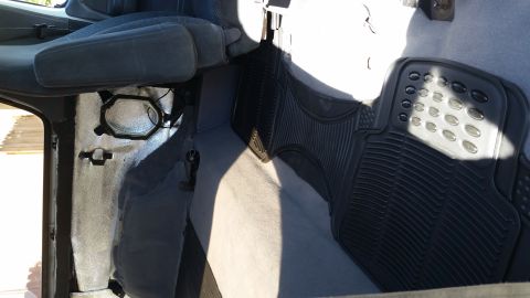 1992 Ford Bronco - Interior view of a vehicle, focusing on the driver's seat and floor mat.