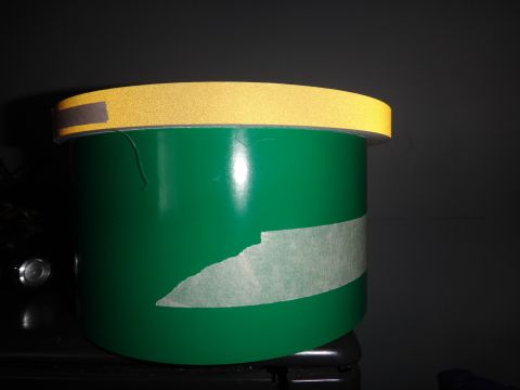 1995 Chevrolet P30 1 Ton - Step Van - A green cylindrical object with yellow reflective tape around the top edge.
