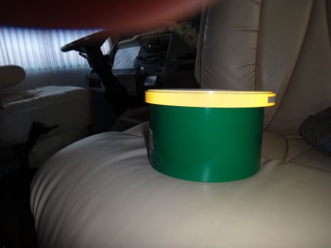 1995 Chevrolet P30 1 Ton - Step Van - Interior view of a vehicle, focusing on a green container placed on a seat.