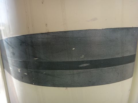1995 Chevrolet P30 1 Ton - Step Van - Close-up side view of a white step van a dark gray stripe. The Supermotors.net logo is visible in the lower right corner.