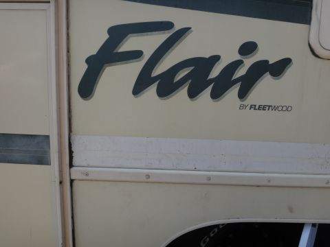 1995 Chevrolet P30 1 Ton - Step Van - RV exterior detail with 'Flair' decal by Fleetwood and Supermotors.net branding.