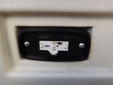 1995 Chevrolet P30 1 Ton - Step Van - A close-up view of a black plastic housing containing a white label with part information.