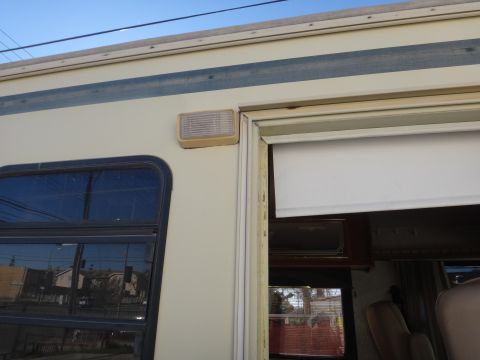 1995 Chevrolet P30 1 Ton - Step Van - Exterior view of an RV, focusing on the door frame and a side marker light.