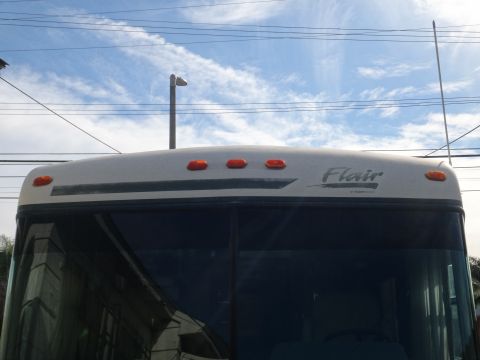 1995 Chevrolet P30 1 Ton - Step Van - The top section of an RV shows amber marker lights and the 'Flair' model name.