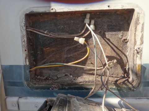 1995 Chevrolet P30 1 Ton - Step Van - This image shows exposed wiring and connectors within a recessed compartment, likely related to exterior lighting or electrical components.