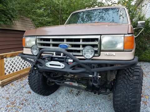 1988 Ford Bronco - Customized 1987 Ford Bronco front end features a heavy-duty bumper and winch setup.