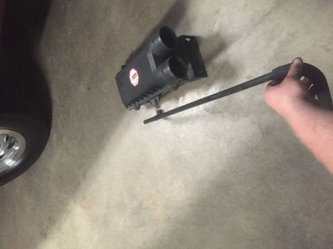 1995 Ford Bronco - A K&N air intake box and filter element are shown, with a hand holding a part of the assembly.