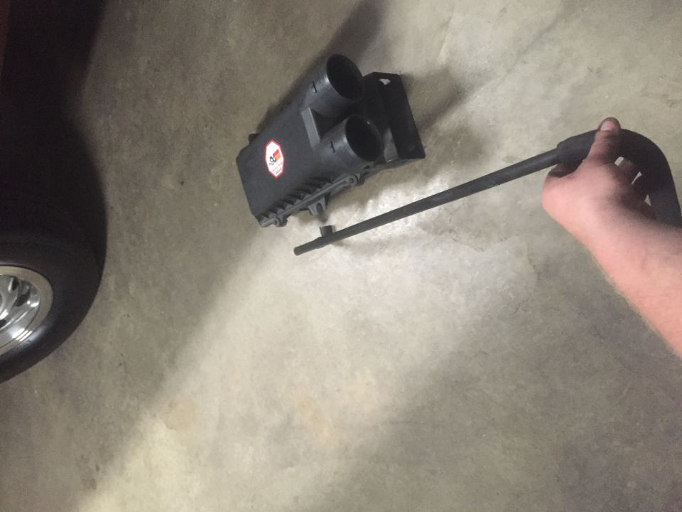 Black air intake box with red K&N sticker and filter element