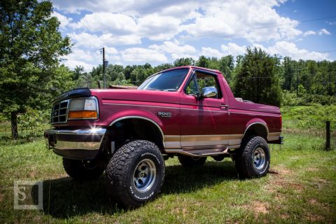 1995 Ford Bronco - This 1995 Ford Bronco is shown in a three-quarter front view, lifted with off-road tires.