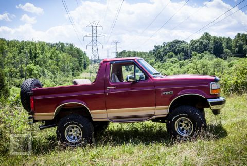 1995 Ford Bronco - This Ford Bronco is shown from the side with a spare tire mounted on the back.